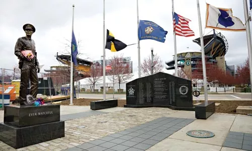 After the Stanton Heights shooting, some mourners paid their respects at the city's police memorial on the North Side.