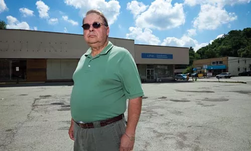 Brookline resident Bob Beiler says UPMC is holding the community "hostage," stalling plans for a new grocery store by not moving a medical practice. - BRIAN KALDORF