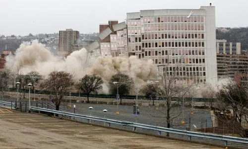 Despite the lack of a CBA with Hill District groups, preparation for a new hockey arena -- such as the implosion of the old St. Francis Hospital -- continues. - HEATHER MULL