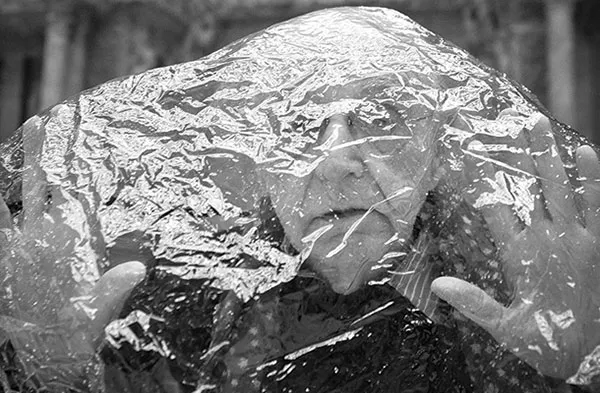 Duane Michals dons a makeshift shroud in the Carnegie Museum's Hall of Sculpture.