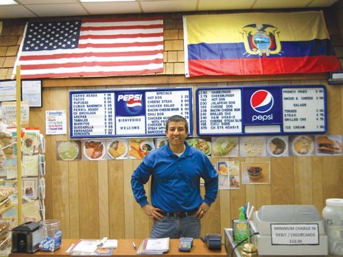 Jorge Flores works to make his community as diverse as the flags on the wall of his restaurant, La Colombiana.