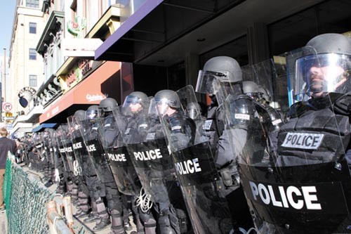 June 2006: Police in riot gear await yet another Oakland protest. - PHOTO BY RENEE ROSENSTEEL