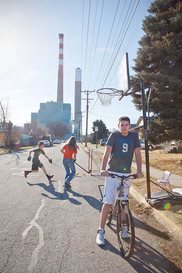 Kids play on Garfield Street in Springdale on the first spring-like day in March. - PHOTO BY HEATHER MULL