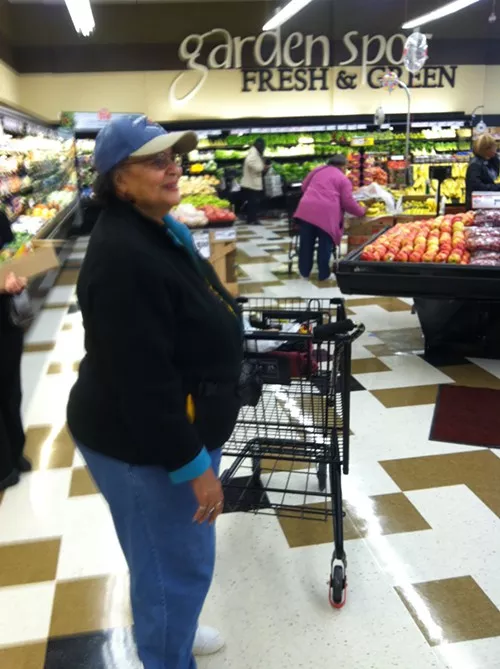 Lifelong Hill District resident Eunice Bradberry takes her first trip through the new grocery store.