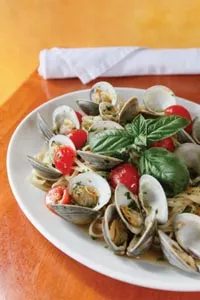 Linguine alle Vongole with fresh Manilla clams, cherry tomatoes and garlic in a white-wine sauce - HEATHER MULL