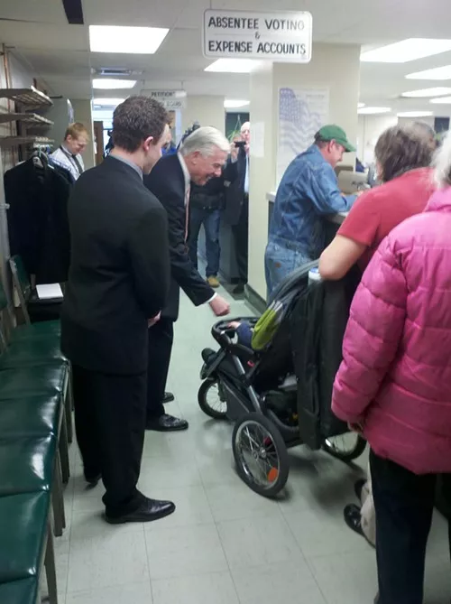 Mayoral candidate Jack Wagner high fives a baby before filing his election petitions Tuesday