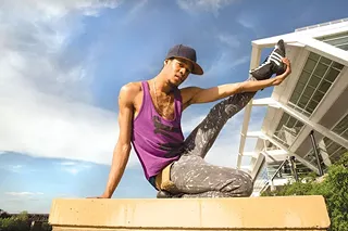 Michael Brookins, a Project Silk staff member, poses in front of the convention center.