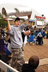 Mike Gallucci and Nolan Latterman, both of Baldwin, hoist the cup during May 26th's playoff game between the Penguins and the Hurricanes. - BRIAN KALDORF