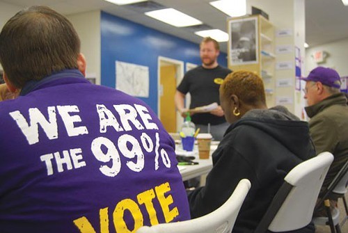 Obama campaign volunteers, including a group from SEIU, listen to neighborhood team leader Matt Phillips give canvassing instructions Oct. 6.