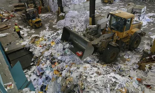 Paperwork: Recycle Management moves the pile at its Neville Island facility. - HEATHER MULL