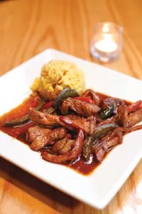 Pork marinated in a traditional Spanish style, with paprike, garlic and olive oil. - HEATHER MULL