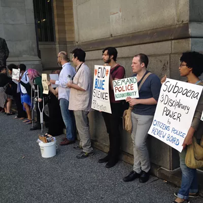 Protesters turn out for city's opening case in police contract arbitration