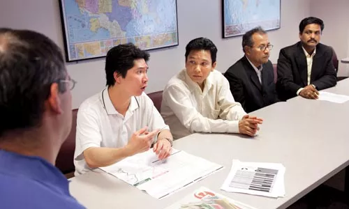 Public transportation is the only way that (from left) Chuin Wen Siw, Mya Thar Aye, Gopi Lal Khawas Bhujel and Krishna B. Thatal have to get to their English classes downtown. - BRIAN KALDORF