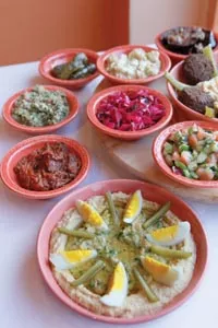 Sababa hummus (foreground), with assorted appetizers - HEATHER MULL