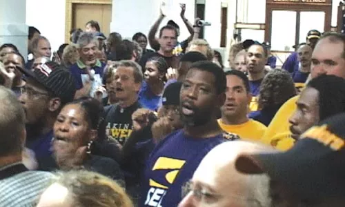 Some 100 union members demonstrated outside the door to Mayor Luke Ravenstahl's office for an hour, demanding to discuss city development policy. - CHRIS POTTER