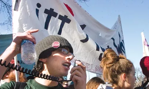 Todd Saulle and Jenna Holsing of Pitt Against War lead local students at the Jan. 27 anti-war march in Washington, D.C. - GABRIEL CASHMAN