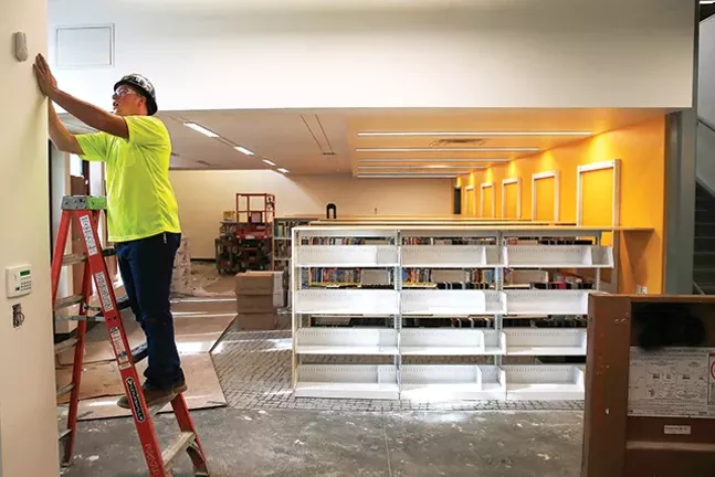 Construction takes place at the Carnegie Library in Carrick during a passive house tour on Thu., Oct. 11. - CP PHOTO: JARED WICKERHAM