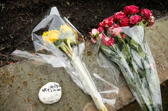 Flowers are left at a nearby intersection following a mass shooting at the Tree of Life Synagogue in Squirrel Hill on Sat., Oct. 27. - CP PHOTO: JARED WICKERHAM