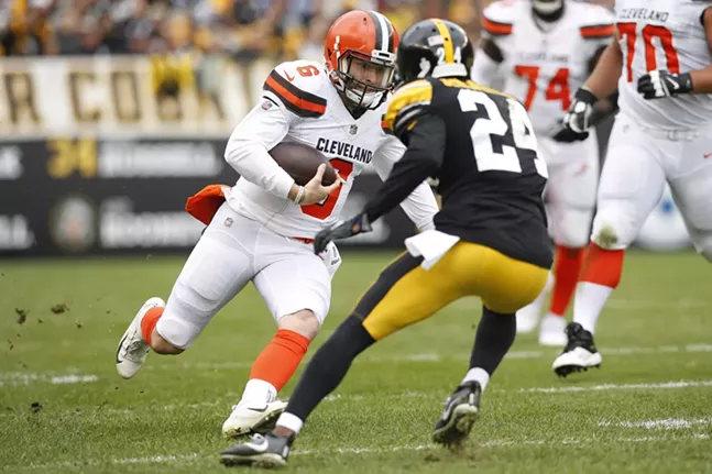 Baker Mayfield #6 of the Cleveland Browns runs with the ball past Coty Sensabaugh #24. - CP PHOTO: JARED WICKERHAM