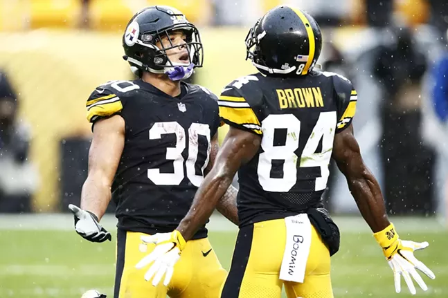 All four touchdowns came at the hands of Conner and Brown, who celebrated together in the endzone. - CP PHOTO: JARED WICKERHAM