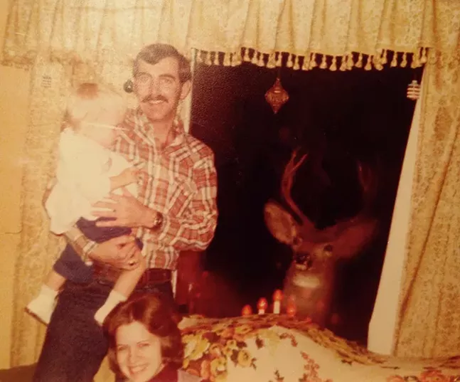 Editor-in-chief Lisa Cunningham is introduced to “Santa’s reindeer” on Christmas Eve - CUNNINGHAM FAMILY PHOTO