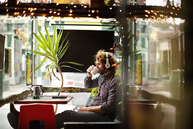 Gary Musisko of Regent Square listens to music in the window at Beehive Coffee. - CP PHOTO: JARED WICKERHAM