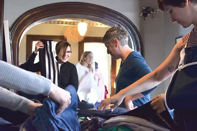 Rachel Rearick, Carin Mincemoyer, and Rachel Yonan swap clothes at Renee Piechocki’s Sixth Annual Clothes Swap. - CP PHOTO: TERENEH IDIA