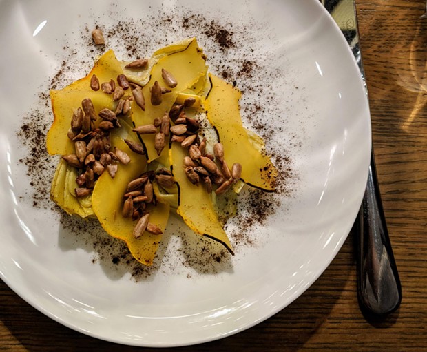 Artichoke topped with sunflower seeds, smoked brined carnival squash, and a dusting of vegetable ash - CP PHOTO: MAGGIE WEAVER