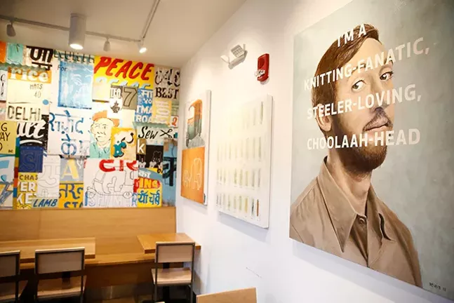 The interior of Choolaah BBQ, which features 25 different original works of art. - CP PHOTO: JARED WICKERHAM