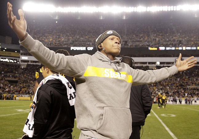 Fan favorite Ryan Shazier gets the crowd pumped up from the sideline. - CP PHOTO: JARED WICKERHAM