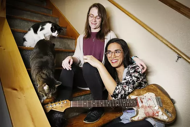 Shannon Keating and Chloe Hodgkins, members of Scratchy Blanket, pose at home with two of their cats. - CP PHOTO: JARED WICKERHAM