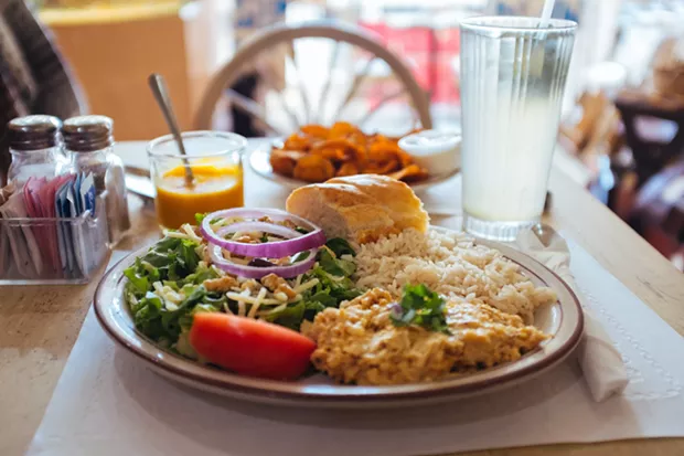 Ají de Gallina (shredded chicken in a creamy peanut sauce) with sweet potato chips - CP PHOTO: JARED MURPHY