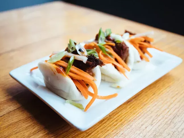 Pork belly steamed buns with pickled carrots, daikon radish, scallions, and Thai BBQ sauce - CP PHOTO: JARED MURPHY