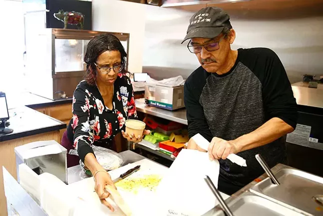 Randy and Becky Thompson prepare a to-go meal at their restaurant. - CP PHOTO: JARED WICKERHAM