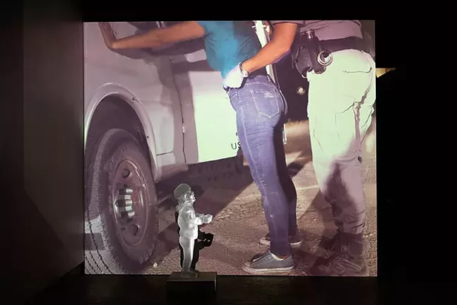 Jaime Guerrero’s glass representation of Yanela Sanchez, a two-year-old girl featured in a viral photo where she was seen crying as her mother was searched by Border Patrol agents - NATHAN J. SHAULIS