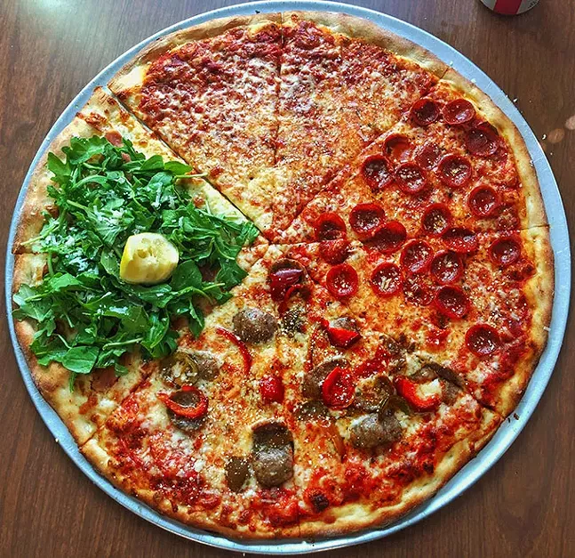 A mixed pie from Rockaway Pizzeria: (clockwise from top) plain, pepperoni, hot sausage and peppers, prosciutto and arugula - PHOTO: DAN TALLARICO
