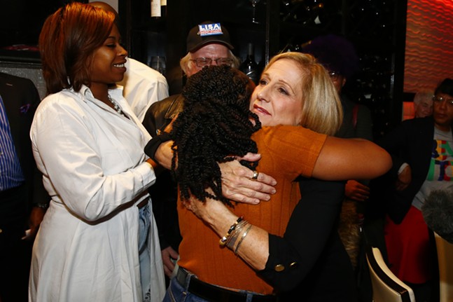Summer Lee hugs Lisa Middleman following her speech. - CP PHOTO: JARED WICKERHAM