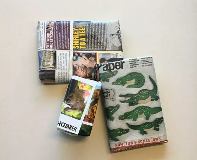 Presents wrapped in a City Paper, a tabloid, and pages from a page-a-day calendar - CP PHOTO: HANNAH LYNN