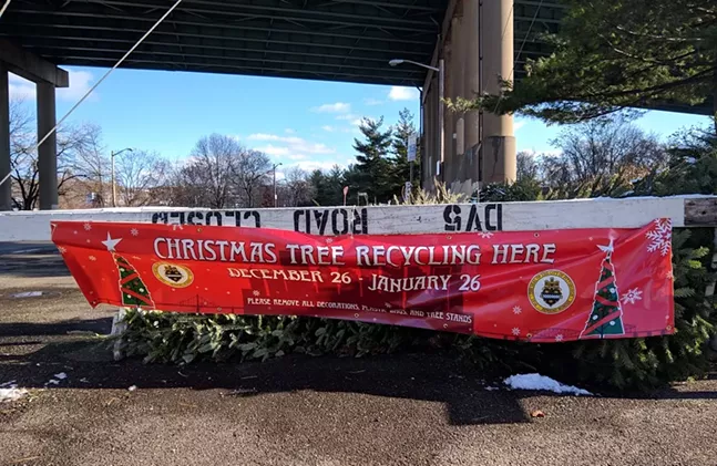 Christmas tree recycling drop-off under the Birmingham Bridge in the South Side. - CP PHOTO: ABBIE ADAMS