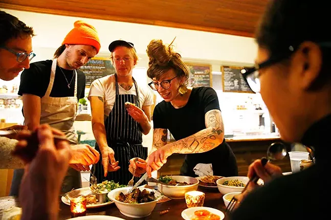 Co-owners of the Fet-Fisk pop-up dinners, Sarah LaPonte and Nik Forsberg, taste test food with their staff prior to the start of their pop-up dinner at Pear and the Pickle in Troy Hill. - CP PHOTO: JARED WICKERHAM