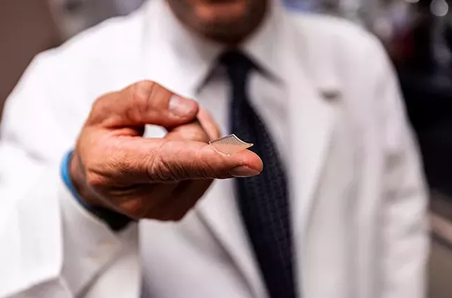Microneedle Array Vaccine: The vaccine is delivered into the skin through a fingertip-sized patch of microscopic needles. - PHOTO: UPMC