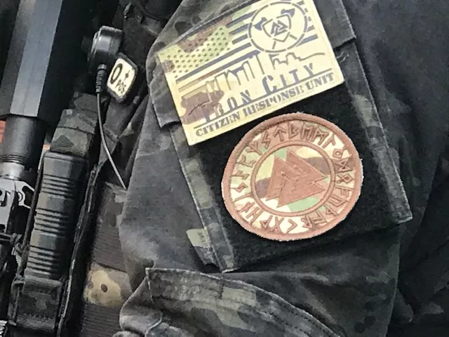 Close up of Iron City Citizens Response Unit decal containing Valknot (top) and a larger Valknot patch (bottom) - CP PHOTO: RYAN DETO