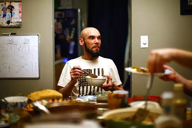 Mohcine Eljoufri, director of the Islamic Center of Pittsburgh, breaks fast with his family at their home during Ramadan on Sun., May 3, 2020. - CP PHOTO: JARED WICKERHAM