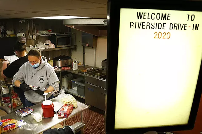 Riverside Drive In co-owner Emma Ross puts together to-go orders at the theater's concession stand on Sat., May 9, 2020 in Vandergrift, Pa. - CP PHOTO: JARED WICKERHAM