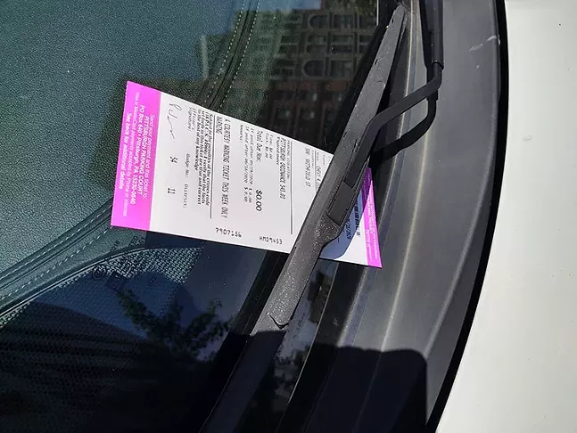A courtesy parking ticket left on a car window on Smithfield Street in Downtown Pittsburgh on Mon., May 18, 2020. - CP PHOTO: KEVIN SHEPHERD