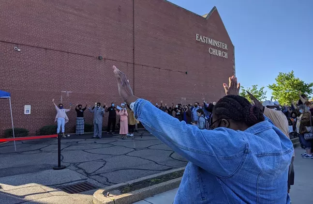 Worshipers raise their hands during a community prayer vigil for racial justice and reconciliation at the Eastminster Presbyterian Church on May 31, 2020. - CP PHOTO: AMANDA WALTZ