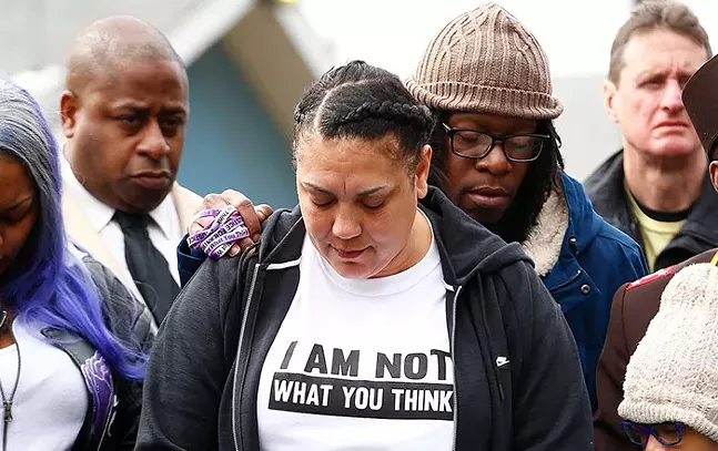 Michelle Kenney joined community members inside Hawkins Village for a vigil in honor of Antwon Rose II on Sun., March 24, 2019. - CP PHOTO: JARED WICKERHAM