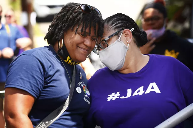 Danielle Brown, mother of Marquis Brown who died in his dorm room at Duquesne University, shares a moment with Michelle Kenney, mother of Antwon Rose II following her speech. - CP PHOTO: JARED WICKERHAM
