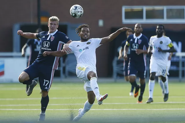 Thomas Vancaeyezeele #17 of the Pittsburgh Riverhounds fights for possession of a ball against Nick Moon #17 of Indy Eleven in the first half. - CP PHOTO: JARED WICKERHAM