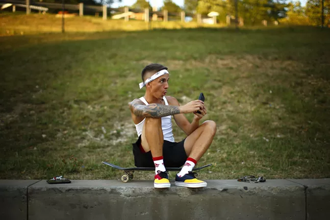 Scott Ross reacts while filming his friends at Pitcher skatepark on his iPhone. - CP PHOTO: JARED WICKERHAM
